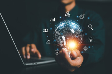 Businessman holding Global network connection. Big data analytics and business intelligence concept. World map point and line composition concept of global business.	
