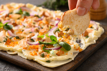 Trendy Butterboard with onion, garlic, orange, herbs , crispy baguette and toasts. Close up.