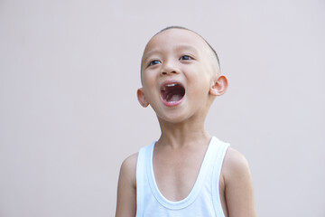 Asian boy smiling happily room wall background