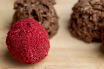 Red sweet candy in the shape of a ball on the table