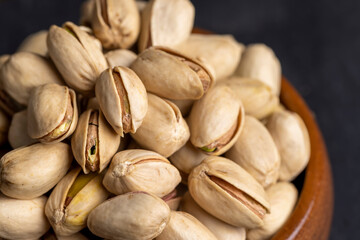 Crispy delicious pistachios with salt on the table