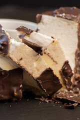 Fresh sweet cake with milk taste and aroma in chocolate glaze