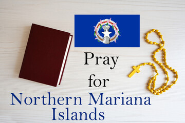 Pray for Northern Mariana Island. Rosary and Holy Bible background.