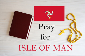Pray for Isle of Man. Rosary and Holy Bible background.