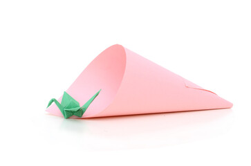 Green origami bird on cone