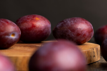 Ripe delicious plums of dark color
