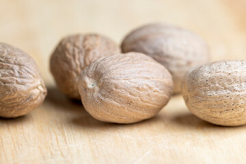 A whole nutmeg fruit on the kitchen table