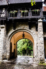 Fototapeta na wymiar Tourist Complex La Tunuri - Vila Economat. Gates of former Royal Guard Office of Peles Castle. Sinaia, Romania.