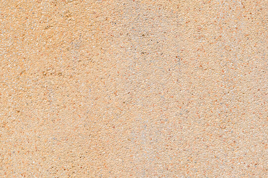 Aggregate orange sandwash texture and background, old sandwash wall