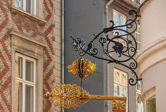 Copenhagen, Denmark - September 13, 2010: Wrought large Golden keys above at Sankt Peders and Larslejsstraete corner, now a Thai Massage service. House facades in different styles