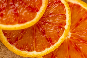 the red-orange flesh of an orange sliced in close-up