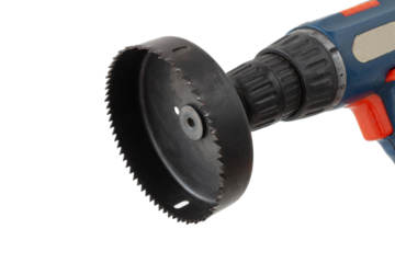 hole saw with attachment on an electric screwdriver, for drilling round holes in furniture or drywall, isolated, cut out