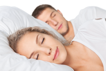 Young  couple sleeping on the bed in bedroom
