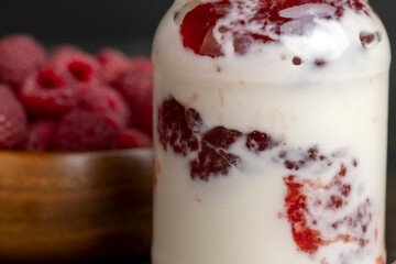 Fresh milk yogurt with whole fresh raspberries