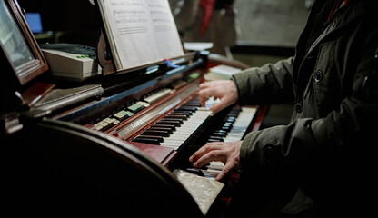 Vintage, Old church organ, organ keyboard, playing men's hands - Powered by Adobe