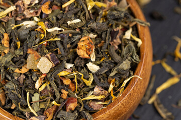 fresh green tea with pieces of fruit and berries
