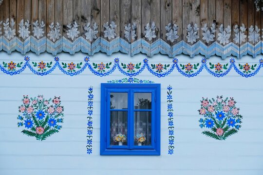 Zalipie, Poland - circle June, 2020: Traditional hand painted floral decorations on old wooden house in famous polish village Zalipie.