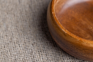 an old empty wooden bowl on the table