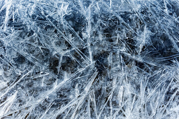 Blue melting ice texture. Texture of ice shards. Winter background. Fragmented ice crystals