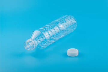 Close up of an empty used plastic bottle on blue background,Recyclable waste