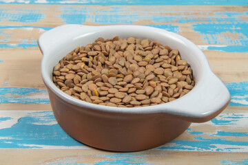 bowl with lentils on blue rustic wooden table