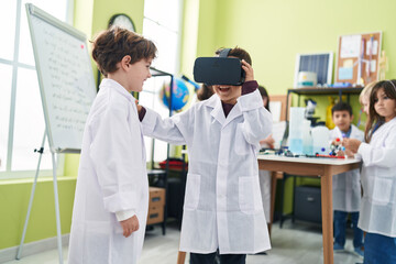 Group of kids students using virtual reality glasses at laboratory classroom