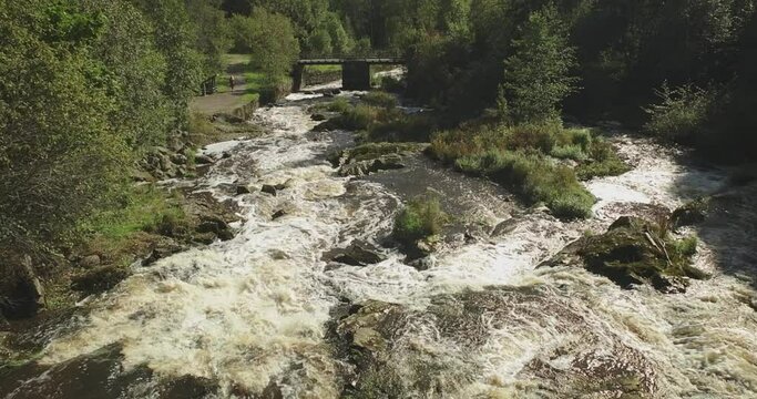 Landscape view of Myllykoski rapids and wooden bridges in autumn, Nurmij&auml;rvi, Finland.