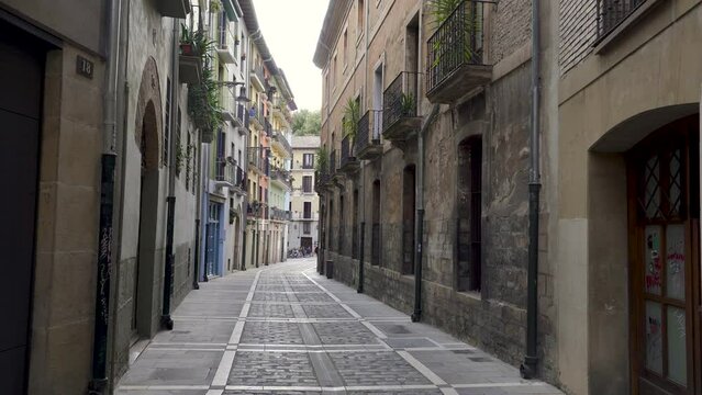 Pamplona, Navarra, SPAIN. The beautiful streets of the city of Pamplona. Beautifully coloured buildings with flowers of different colours, hanging from the balconies. Empty streets. Static video
