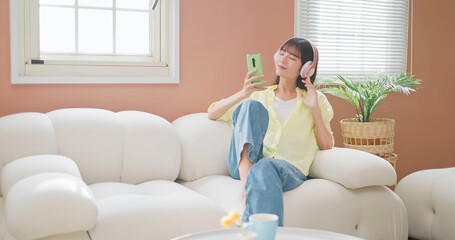 asian girl enjoy mobile music