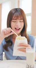 girl eat fries bubble tea