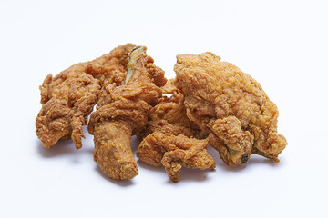 Pile of Crispy Fried Chicken with flour coating, isolated white background