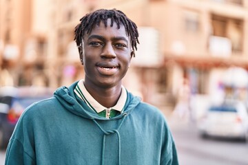 African american man smiling confident standing at street