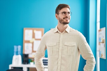 Young caucasian man business worker smiling confident at office