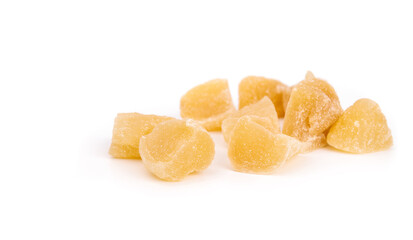 Candied ginger pieces in random pile. Many yellow chunks of candied or crystallized ginger. Healthy...
