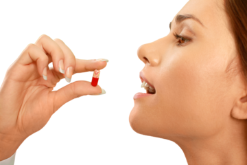 Woman taking a tablet