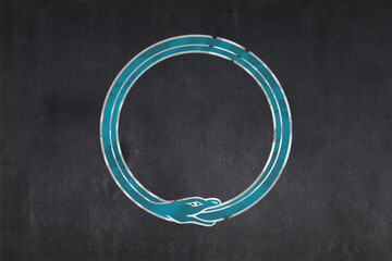 Ouroboros symbol drawn on a blackboard