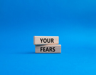 Your fears symbol. Wooden blocks with words Your fears. Beautiful blue background. Business and Your fears concept. Copy space.
