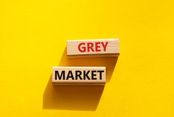 Do grey market. Wooden blocks with words grey market. Beautiful yellow background. Business and grey market concept. Copy space.