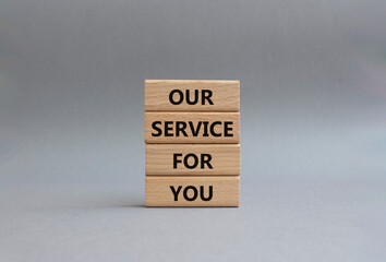 Our service for you symbol. Wooden blocks with words Our service for you. Beautiful grey background. Business and Our service for you concept. Copy space.