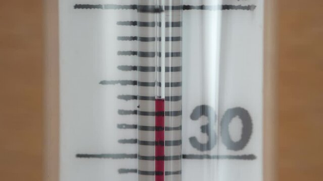 Glass thermometer on 34 degrees close up
