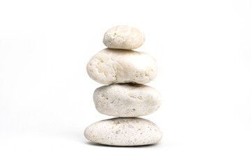 Fototapeta na wymiar pile of white stones isolated on white background. Stones pyramid. Life balance and harmony concept 