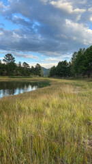 Colorado campground pond surrounded by mountains