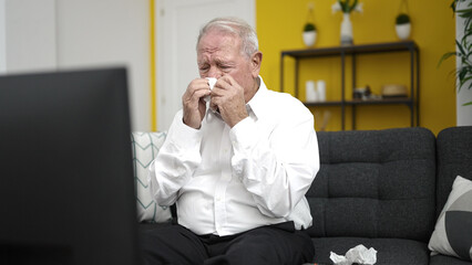 senior watching movie crying at home