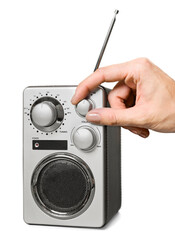 Human hand tuning radio receiver isolated on white