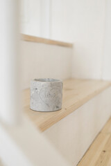Concrete candle holder in the interior