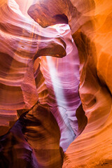 Light beams at Upper Antelope Canyon in the Navajo Reservation Page Northern Arizona. Most famous slot canyon. Light showing off the glamorous detail of the ancient spiral rock arches. Rock formation,