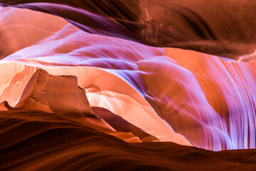 Antelope Canyon in the Navajo Reservation Page Northern Arizona. Famous slot canyon. Little Monument Valley. Beams of sunlight poke through the sandstone and illuminate the canyon and surrounding rock