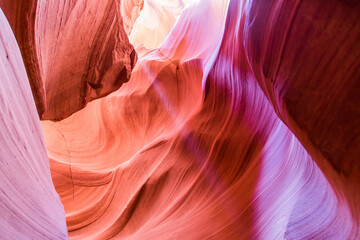 Antelope Canyon in the Navajo Reservation Page Northern Arizona. Famous slot canyon. Light showing off the glamorous detail of the ancient spiral rock arches. Rock formation, game of lights.