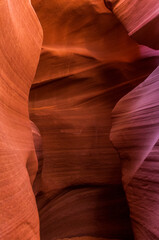 Fototapeta na wymiar Antelope Canyon in the Navajo Reservation Page Northern Arizona. Famous slot canyon. Light showing off the glamorous detail of the ancient spiral rock arches. Multicolored texture, rock formation.