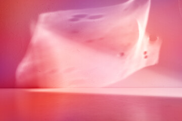 Mock up for presentation, branding products, cosmetics, food or jewellery. Empty table on bright pink wall background. Composition with leaves shadow on the wall and pink table.